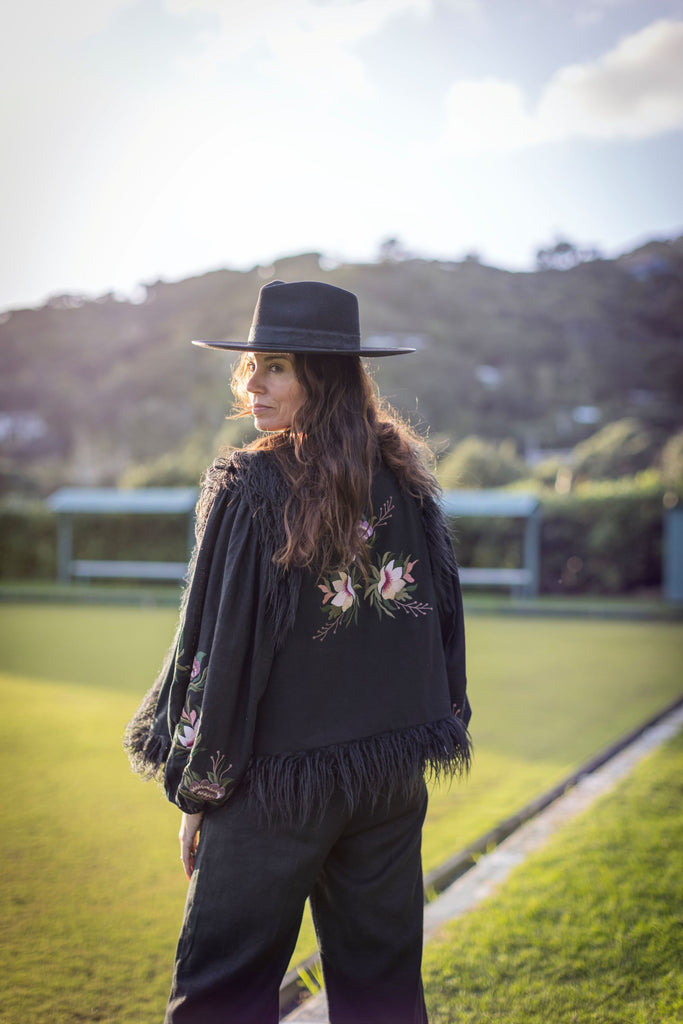 Back view of Midnight Rose vest with signature floral embroidery – M/L