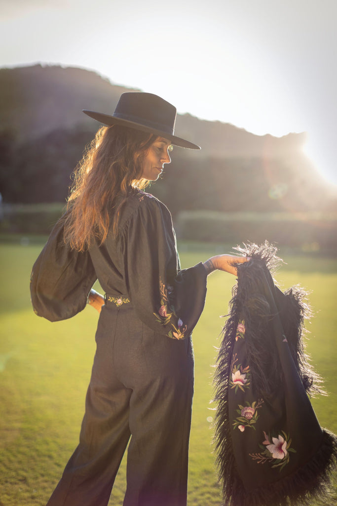 Styled look: faux Mongolian vest layered over matching embroidered blouse and trousers
