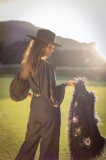 Styled look: faux Mongolian vest layered over matching embroidered blouse and trousers