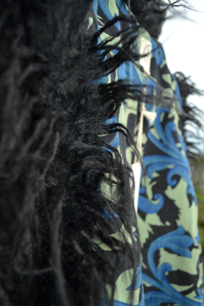 Close-up showing the texture of the blue and black vintage silk sari lining with swirling patterns